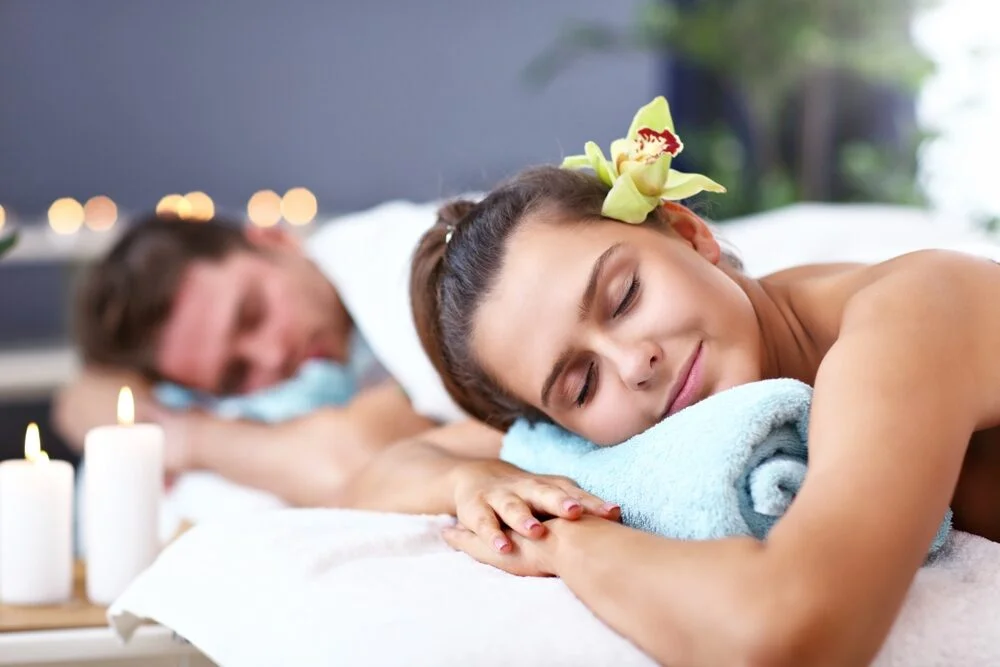Couple enjoying a couples massage session at a professional massage therapy clinic