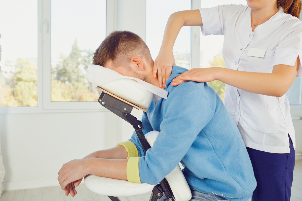 Seated chair massage treatment performed by therapist in Edmonton