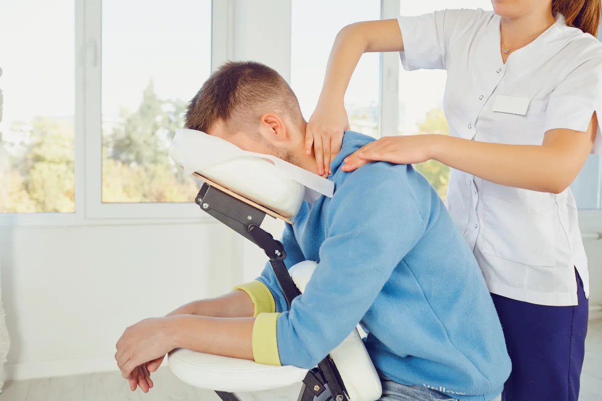 Seated chair massage treatment performed by therapist in Edmonton