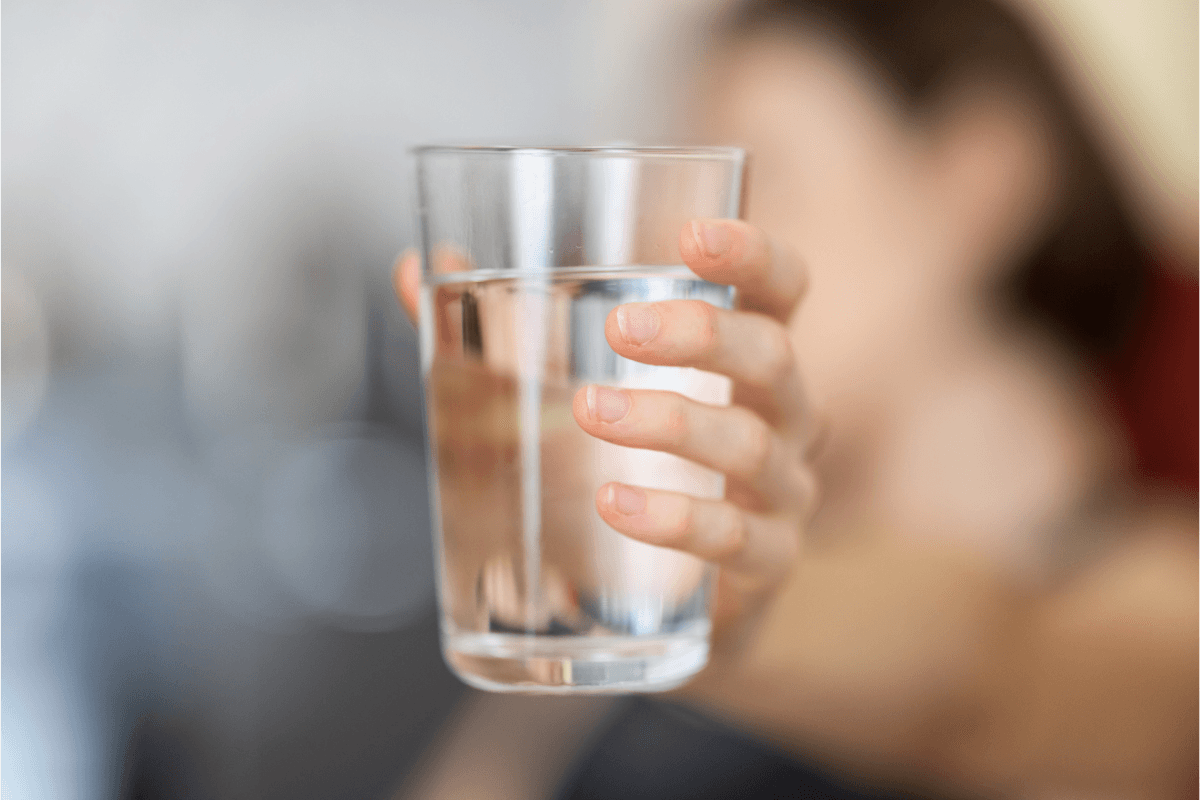 Glass of water offered to client after massage therapy session at Viva Massage and Wellness Edmonton