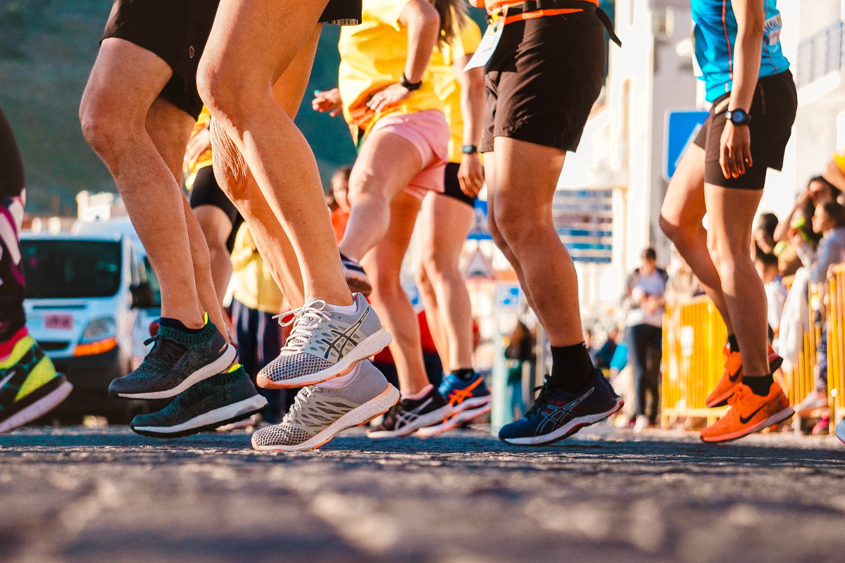 Athletes running in a race representing active clients seeking recovery massage in Edmonton