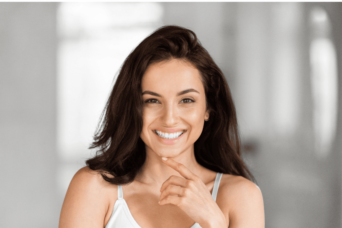 Client experiencing jaw pain relief after TMJ massage therapy in Edmonton